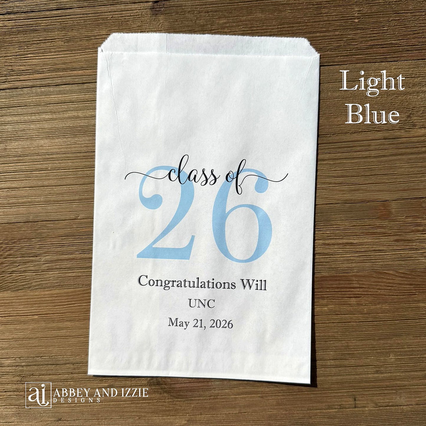 Graduation favor bags for the Class of 2026, perfect size for candy, popcorn, cookies or eating utensils.  White bags personalized for the graduate with class of 26, school name and date.