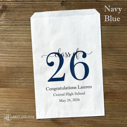 Graduation favor bags for the Class of 2026, perfect size for candy, popcorn, cookies or eating utensils.  White bags personalized for the graduate with class of 26, school name and date.