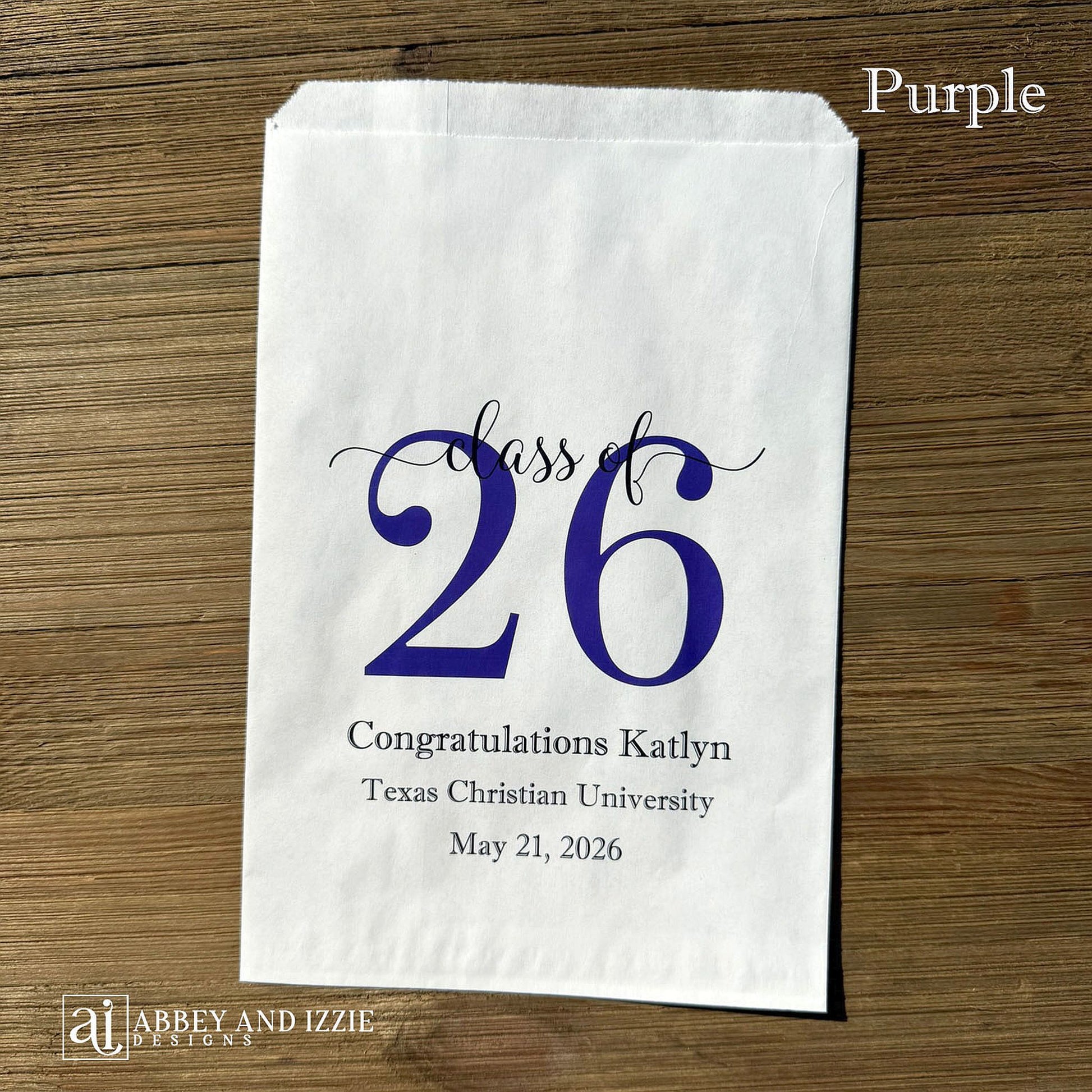 Graduation favor bags for the Class of 2026, perfect size for candy, popcorn, cookies or eating utensils.  White bags personalized for the graduate with class of 26, school name and date.