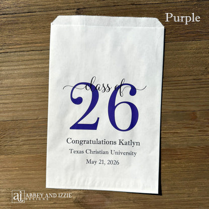 Graduation favor bags for the Class of 2026, perfect size for candy, popcorn, cookies or eating utensils.  White bags personalized for the graduate with class of 26, school name and date.