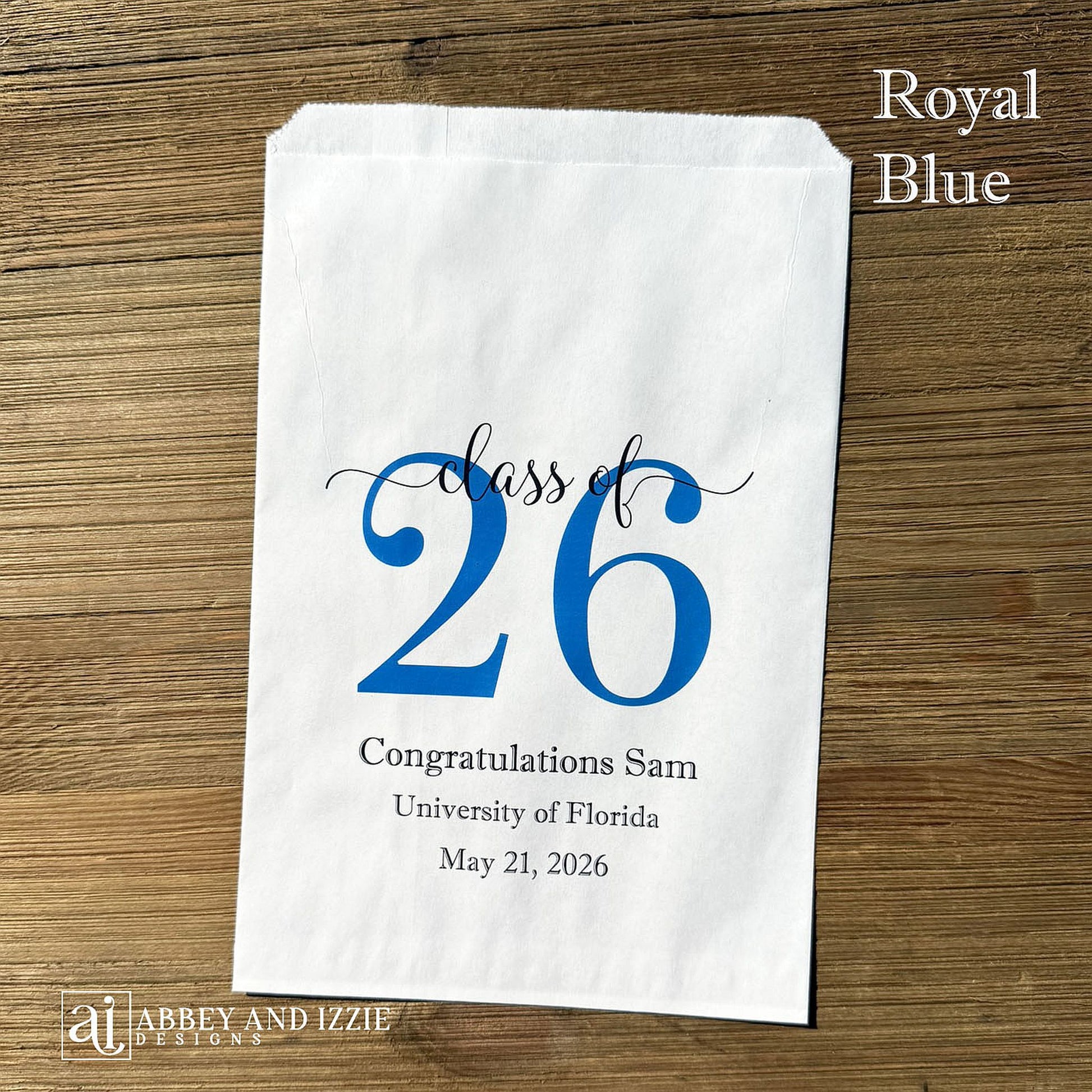 Graduation favor bags for the Class of 2026, perfect size for candy, popcorn, cookies or eating utensils.  White bags personalized for the graduate with class of 26, school name and date.