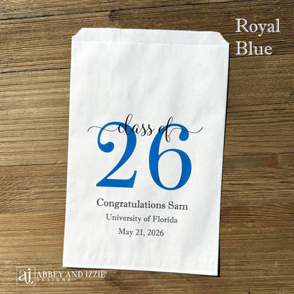 Graduation favor bags for the Class of 2026, perfect size for candy, popcorn, cookies or eating utensils.  White bags personalized for the graduate with class of 26, school name and date.