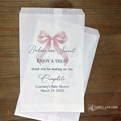 Babies are sweet enjoy a treat thank you for making my day complete.  Adorned with a pink bow and personalized for the mother to be these white bags are perfect for a candy bar or any sweet treat for your guests.  
