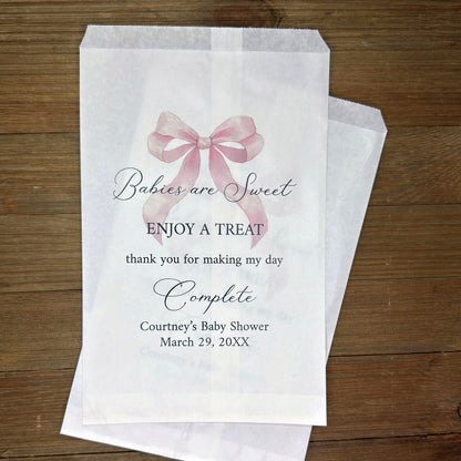 Babies are sweet enjoy a treat thank you for making my day complete.  Adorned with a pink bow and personalized for the mother to be these white bags are perfect for a candy bar or any sweet treat for your guests.  