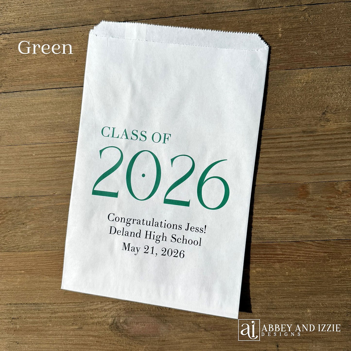 Celebrate the Class of 2026 with Personalized Favor Bags, printed on white bags with the class year in large colored print.  Honors the graudate with name and graduation date.  Your choice of class color to match your theme.  