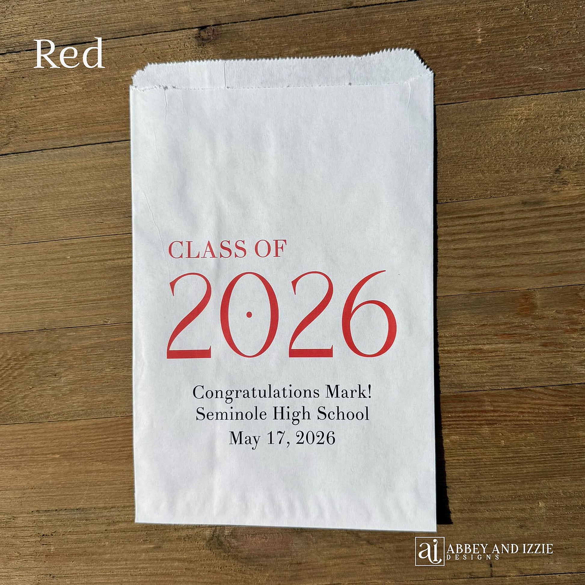 Celebrate the Class of 2026 with Personalized Favor Bags, printed on white bags with the class year in large colored print.  Honors the graudate with name and graduation date.  Your choice of class color to match your theme.  