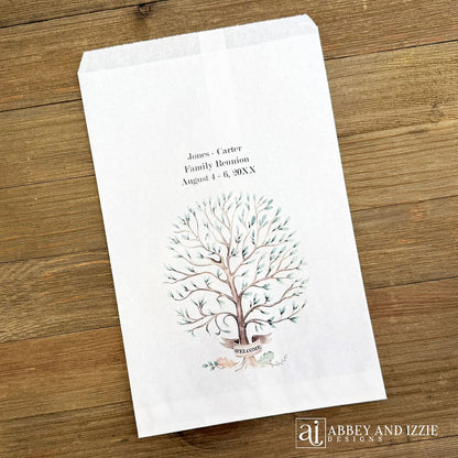 Personalized family reunion favor bags that can be used as utensil bags also.  White bags each is printed with a beautiful tree and personalized with the family name and reunion date.