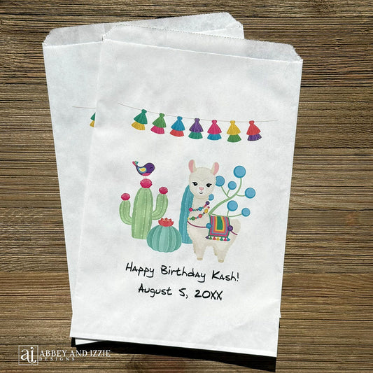 Llama Birthday Party Favor Bags personalized for the guest of honor.  Printed on white bags with a colorful llama and cactus.