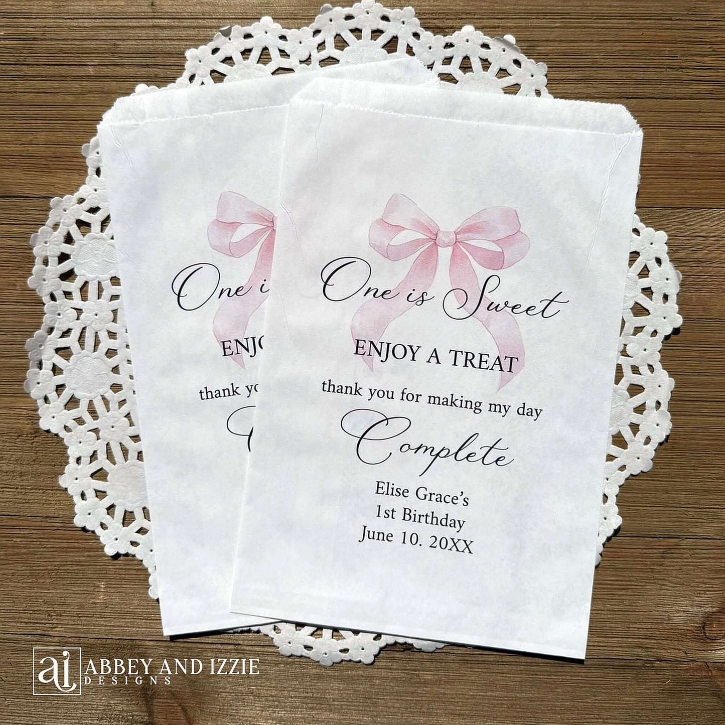 Celebrate your little one's special day with these charming , Girls Birthday Favor Bags with a Pink Bow printed on white bags , personalized for the guest of honor.