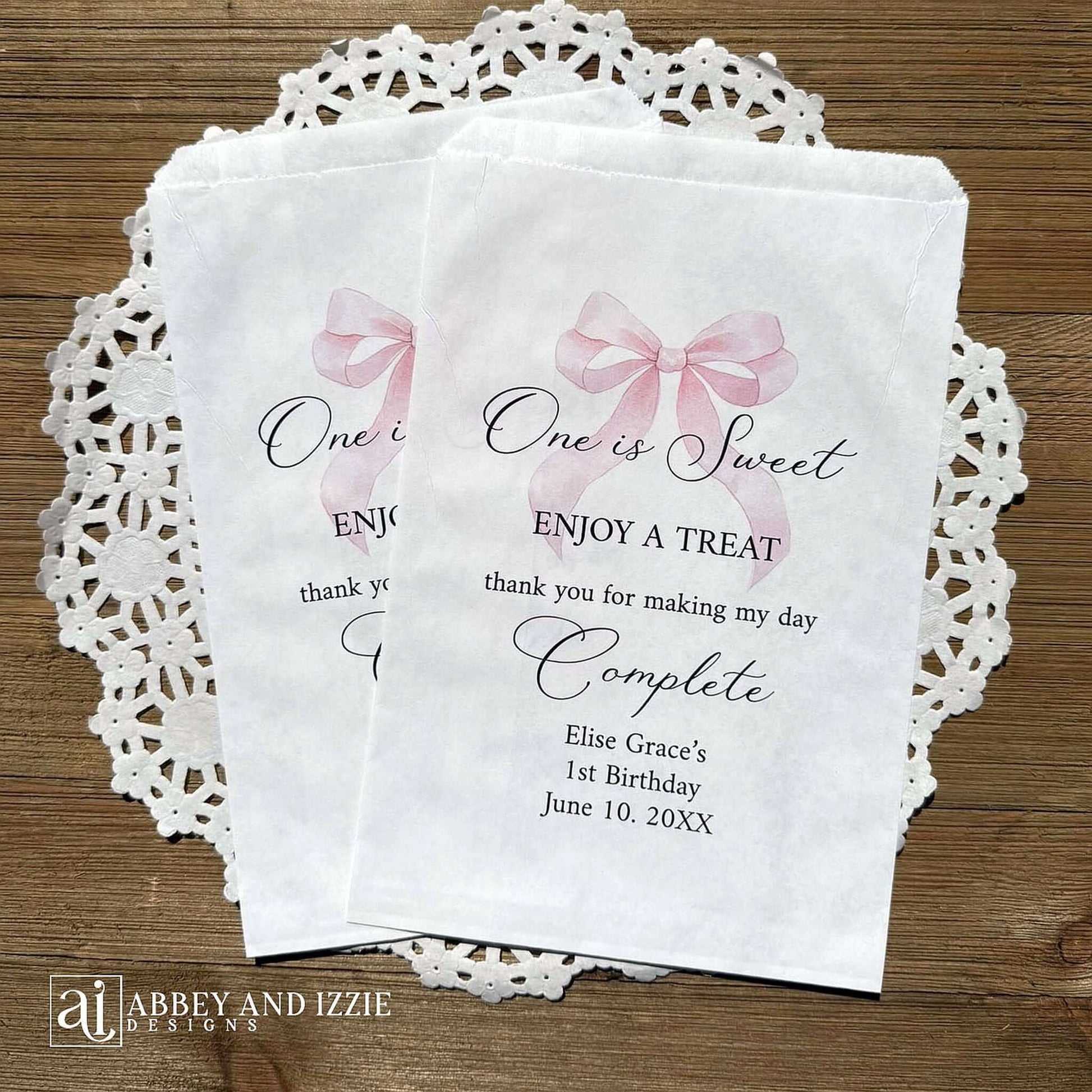 Celebrate your little one's special day with these charming , Girls Birthday Favor Bags with a Pink Bow printed on white bags , personalized for the guest of honor.