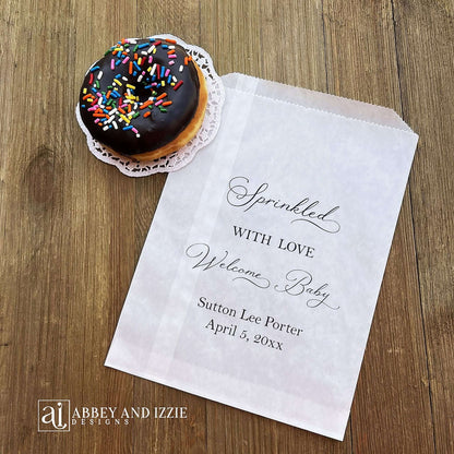 Glassine baby sprinkle favor bags, personalized for the guest of honor.  Bags are glassine and grease resistant.  Larger than most favor bags they measure 6 x 9.  Perfect for donuts, cookies or any sweet treats.