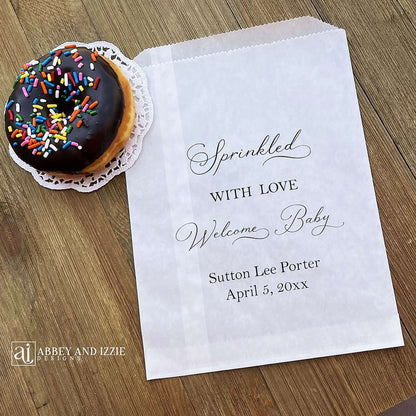 Glassine baby sprinkle favor bags, personalized for the guest of honor.  Bags are glassine and grease resistant.  Larger than most favor bags they measure 6 x 9.  Perfect for donuts, cookies or any sweet treats.