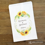 Sunflower Wedding Favor Bags that are personalized for the bride and groom.  Adorned with a sunflower wreath around the names and wedding date.  