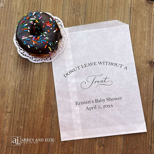 Our personalized donut bags for a baby shower are sure to impress your guests. Printed with 'donut leave without a treat' with the mother to be's name and event date. Bags are glassine so grease resitant, perfect for a donut bar or donut wall.
