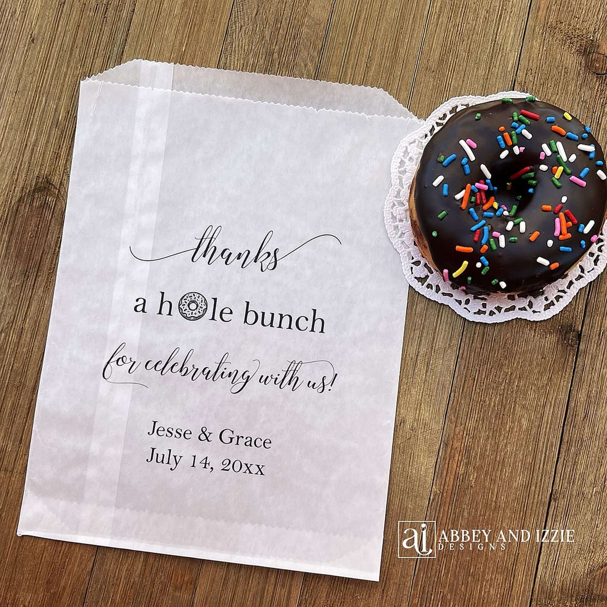 Our personalized wedding donut bags will add a special touch to your donut bar.  Each bag is printed 'thanks a hole bunch for celebrating with us!' with the bride and grooms name and wedding date.  Bags are glassine and grease resistant.  Also great for donut walls.