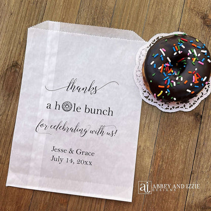 Our personalized wedding donut bags will add a special touch to your donut bar.  Each bag is printed 'thanks a hole bunch for celebrating with us!' with the bride and grooms name and wedding date.  Bags are glassine and grease resistant.  Also great for donut walls.