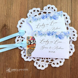 Our blue hydrangea wedding favors are made from white cardstock, adorned with delicate hydrangeas at the top, printed with 'Lucky In Love' with the brdie and grooms names and wedding date.  Each comes with a light blue ribbon attached for an elegant touch.  Guest will find these lotto favors fun with hopes of winning something big.  