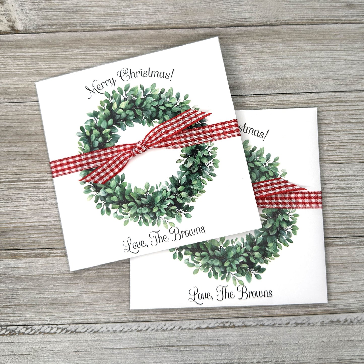 Perfect for holiday gatherings, these personalized gift envelopes add a thoughtful touch for guests, friends or customers. Each 5" × 5" envelope is printed on premium white card stock and arrives fully assembled with ribbon attached ready to slide a lottery ticket or gift card inside. Customize with "Merry Christmas" or "Happy Holidays" and personalize with names or business, your choice of red checked or black checked ribbon.