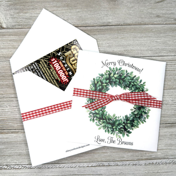 Perfect for holiday gatherings, these personalized gift envelopes add a thoughtful touch for guests, friends or customers. Each 5" × 5" envelope is printed on premium white card stock and arrives fully assembled with ribbon attached ready to slide a lottery ticket or gift card inside. Customize with "Merry Christmas" or "Happy Holidays" and personalize with names or business, your choice of red checked or black checked ribbon.