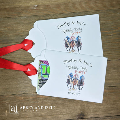 Derby Day Party Favors Lotto , printed on white cardstock and adorned with racing horses these favor are also personalized for you.  Slide a lotto ticket inside to add another layer of fun to your event.  Red ribbon comes attached.