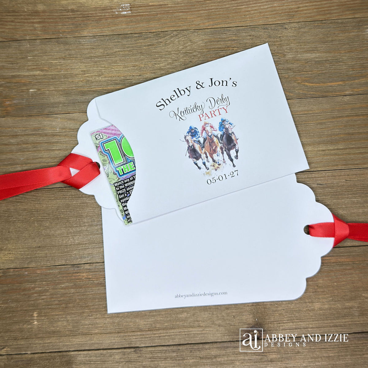 Derby Day Party Favors Lotto , printed on white cardstock and adorned with racing horses these favor are also personalized for you.  Slide a lotto ticket inside to add another layer of fun to your event.  Red ribbon comes attached.