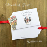 Derby Day Party Favors Lotto , printed on white cardstock and adorned with racing horses these favor are also personalized for you.  Slide a lotto ticket inside to add another layer of fun to your event.  Red ribbon comes attached.