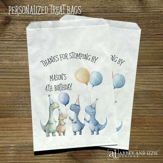 Thanks for Stompling By!  Our dinosaur treat bags are sure to be a hit, adorned with cute dinosuars with hats and balloons to celebrate the honoree.  Personalized with the childs name and birthday year.  Printed on white bags these are colorful and fun!