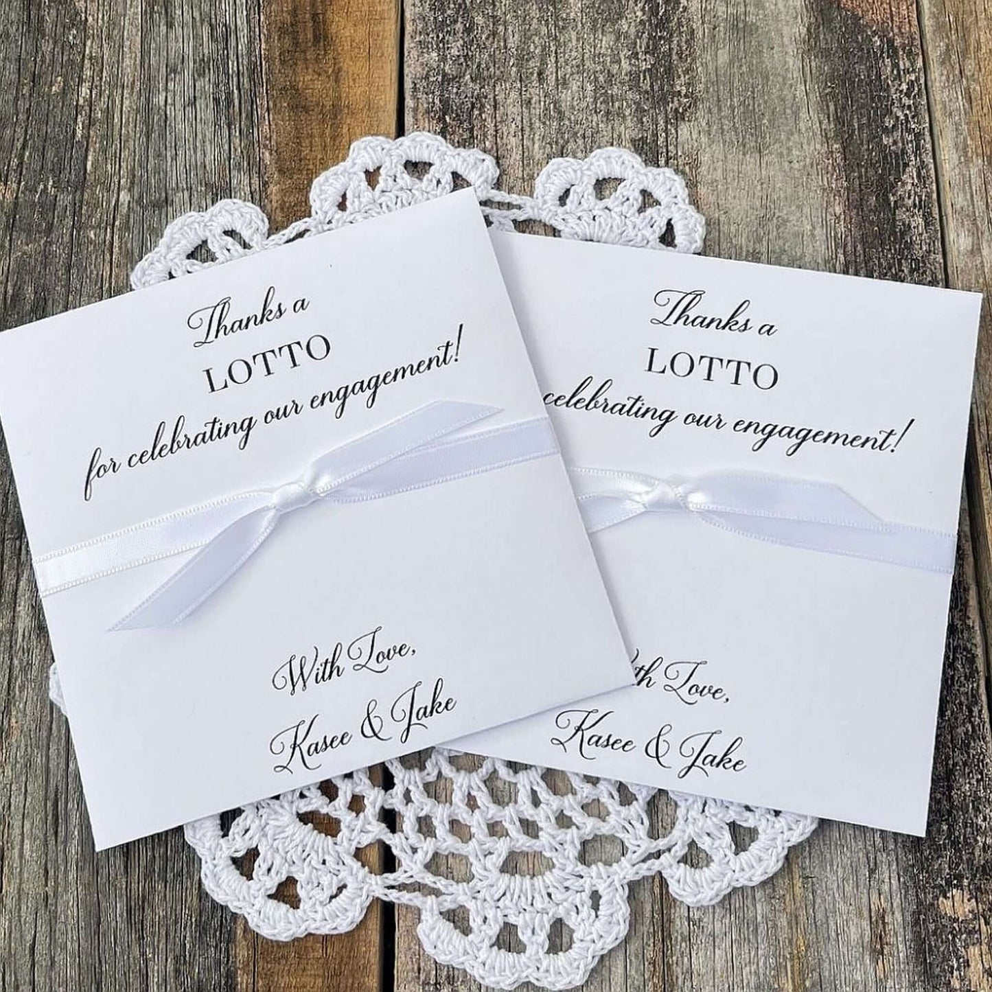 Personalized engagement party favors, slide a lotto ticket in these envelopes to see who wins.  Printed with, thanks a lotto for celebrating our engagement!  with love the happy couple.  White envelopes, your choice of ribbon color which comes attached