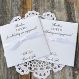 Personalized engagement party favors, slide a lotto ticket in these envelopes to see who wins.  Printed with, thanks a lotto for celebrating our engagement!  with love the happy couple.  White envelopes, your choice of ribbon color which comes attached