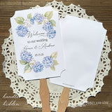 Elevate your wedding ambiance with our personalized blue hydrangea fans, beautifully crafted to complement your special day.  Printed on white card stock with 'welcome to our wedding' and the bride and grooms names with wedding date printed.  Fans ship assembled to you and are two sided, printing on one side only, handle hidden between the layers for a finished look. 