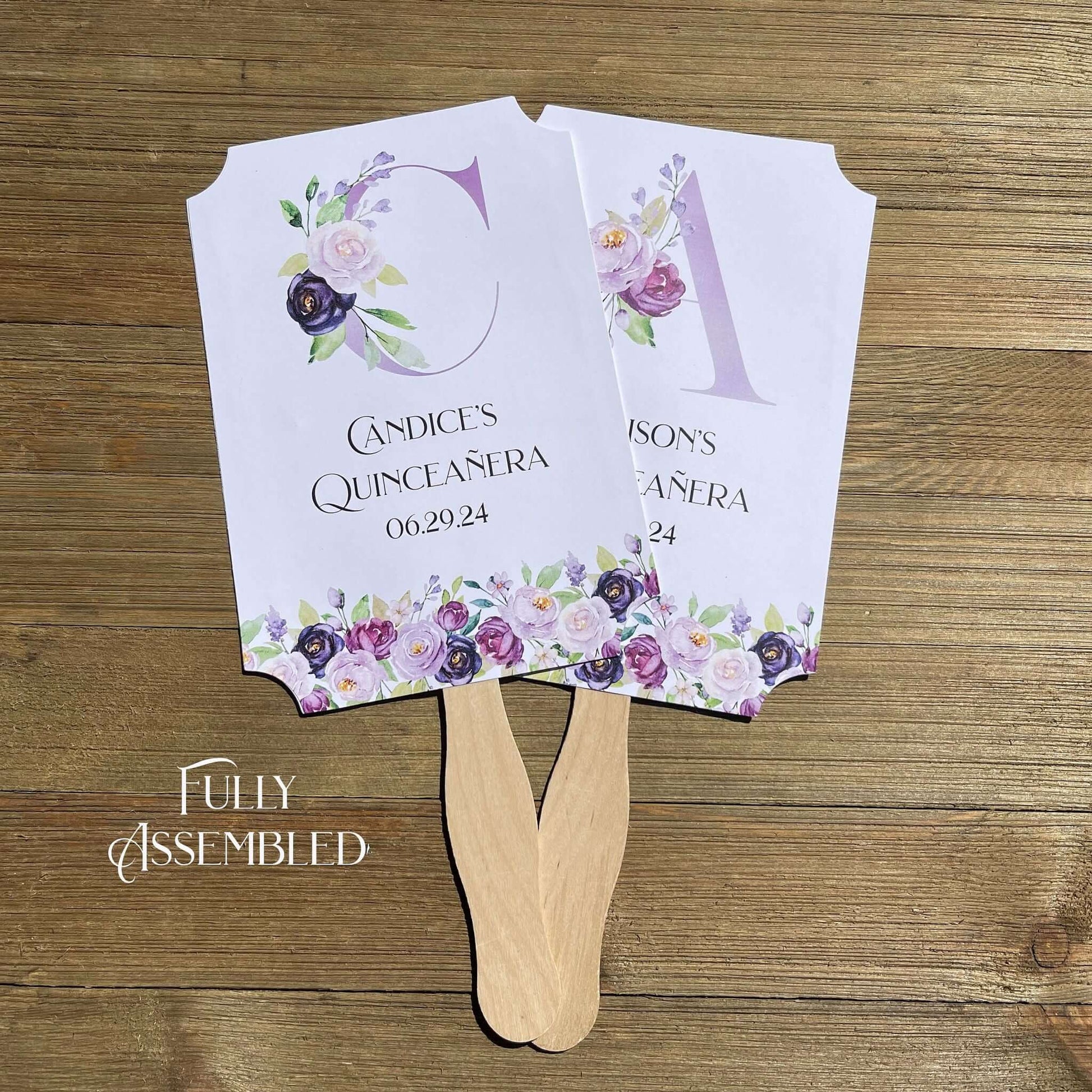 Personalized Quinceanera Favor Fans, Printed on white card stock, purple flowers adorn the bottom with a large floral monogram.  Perfect to keep your guests cool and comortable with a keep sake to take hom