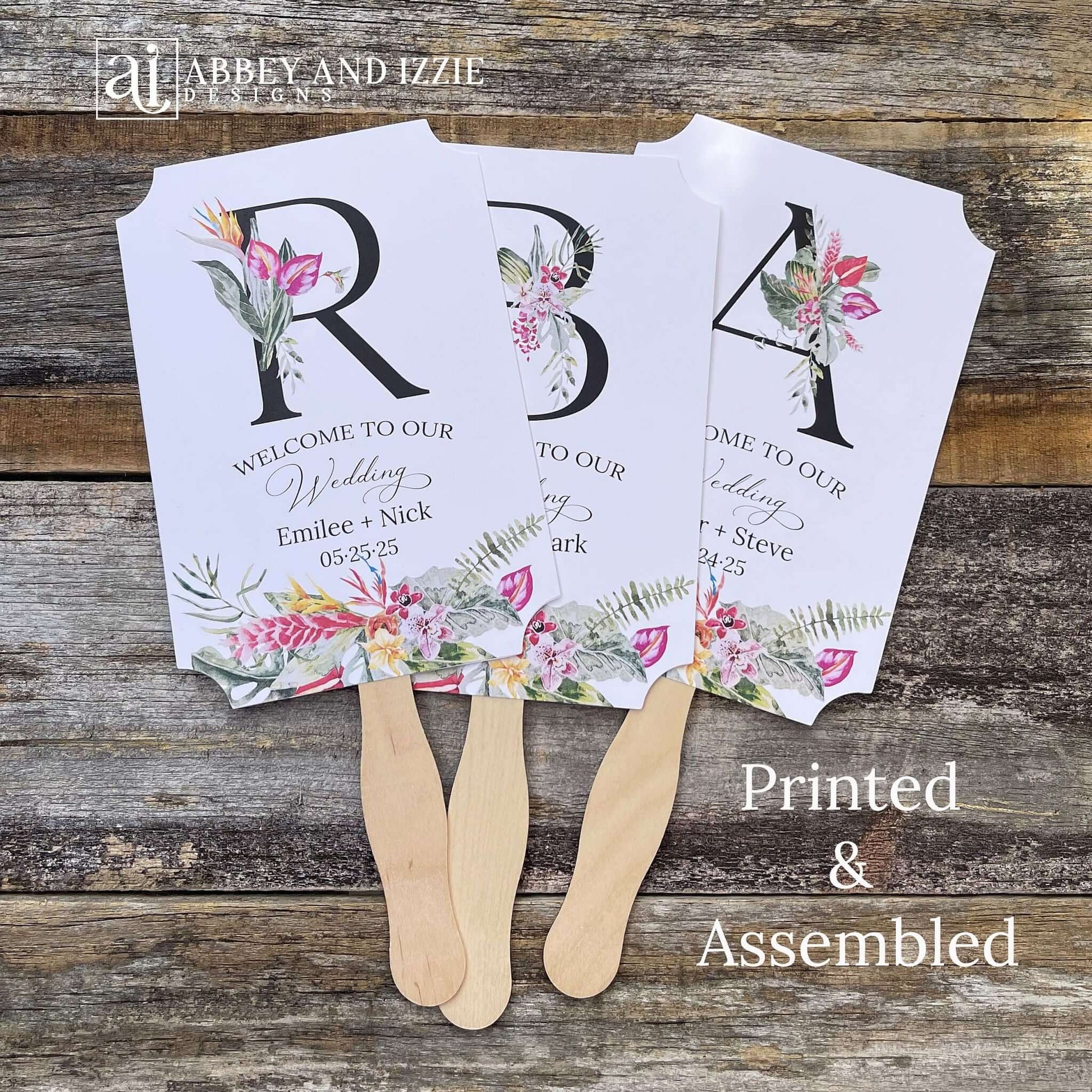  Tropical themed wedding fans monogrammed that are personalized with your large initial, bride and grooms names and wedding date.  Adorned with tropical flowers, printed on white card stock.  A great keepsake to take home as well as keeping your guests comfortable.  Perfect for destination weddings.