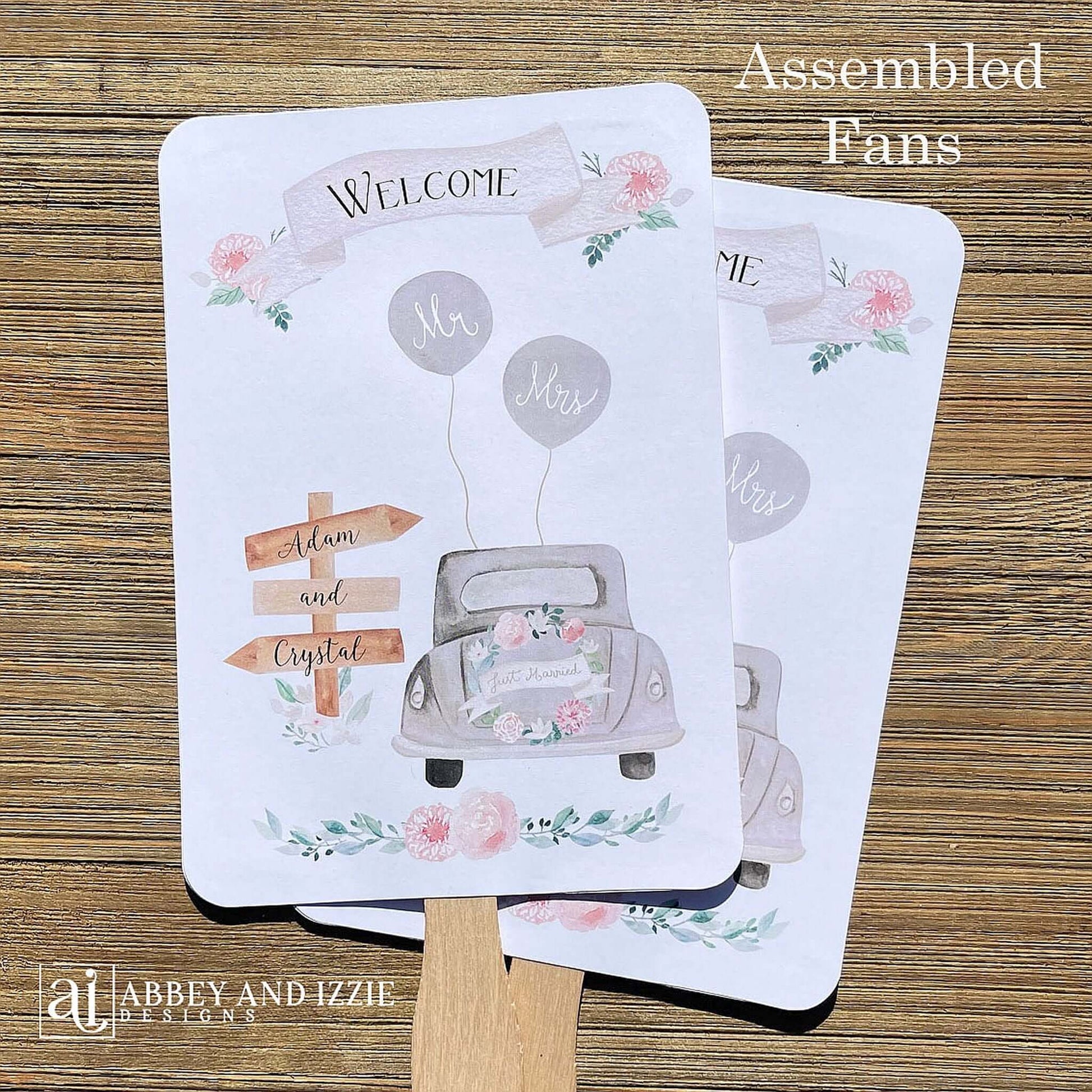 Fun Wedding Fans Personalized for the bride and groom.  Printed with Welcome and a old car with 'just married' on the back.  Fans ship fully assembled and ready for your wedding day.