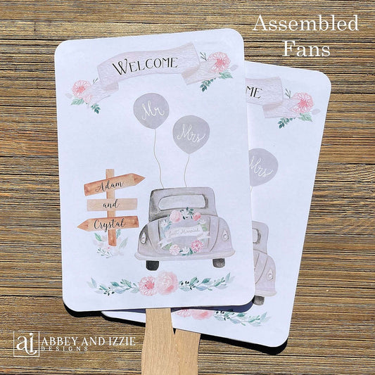 Fun Wedding Fans Personalized for the bride and groom.  Printed with Welcome and a old car with 'just married' on the back.  Fans ship fully assembled and ready for your wedding day.