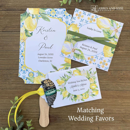 Mediterranean Wedding Program Fans, adorned with blue tiles and lemons. Printed on white card stock, two sided with handle hidden between. Wedding program on the back on the fans, front is personalized for the bride and groom.
