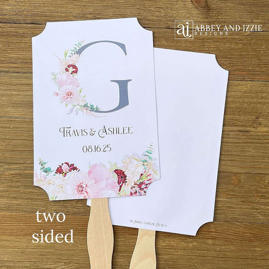 Monogram Wedding Fans, personalized for the bride and groom. Large initial highlighted by pink and burgundy floral. Fans ship fully assembled, 2 sided with hand hidden for a finished look.