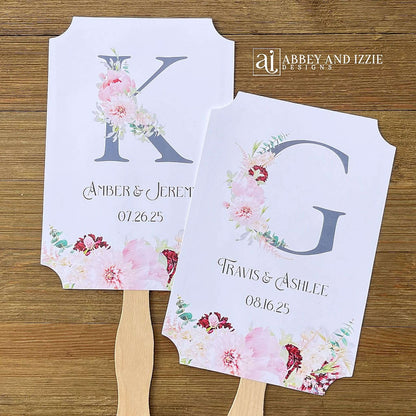 Monogram Wedding Fans, personalized for the bride and groom. Large initial highlighted by pink and burgundy floral. Fans ship fully assembled, 2 sided with hand hidden for a finished look.