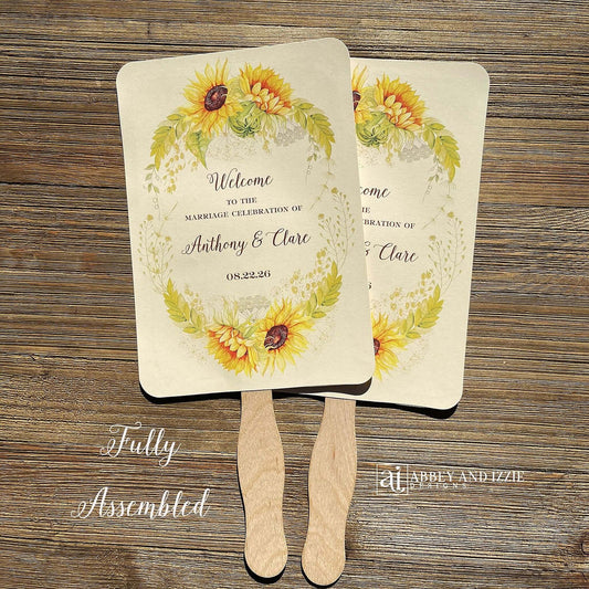 Sunflower Wedding Hand Fans Personalized , personalized for the bride and groom and adorned with a ring of sunflowers.  Fans are printed on ivory cardstock, two sided so handle is hidden between.  Wedding fans ship fully assembled and ready for your big day.