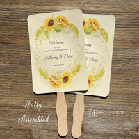 Sunflower wedding fans , personalized for the bride and groom and adorned with a ring of sunflowers.  Fans are printed on ivory cardstock, two sided so handle is hidden between.  Wedding fans ship fully assembled and ready for your big day.