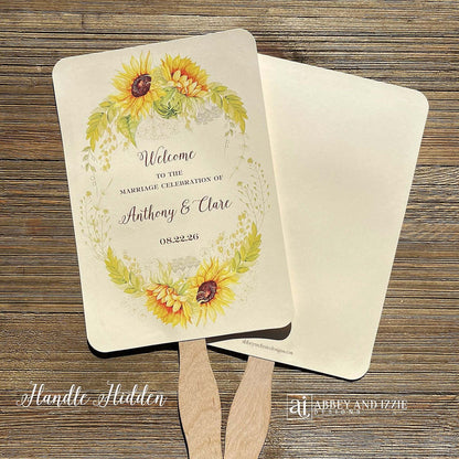 Sunflower Wedding Hand Fans Personalized , personalized for the bride and groom and adorned with a ring of sunflowers.  Fans are printed on ivory cardstock, two sided so handle is hidden between.  Wedding fans ship fully assembled and ready for your big day.