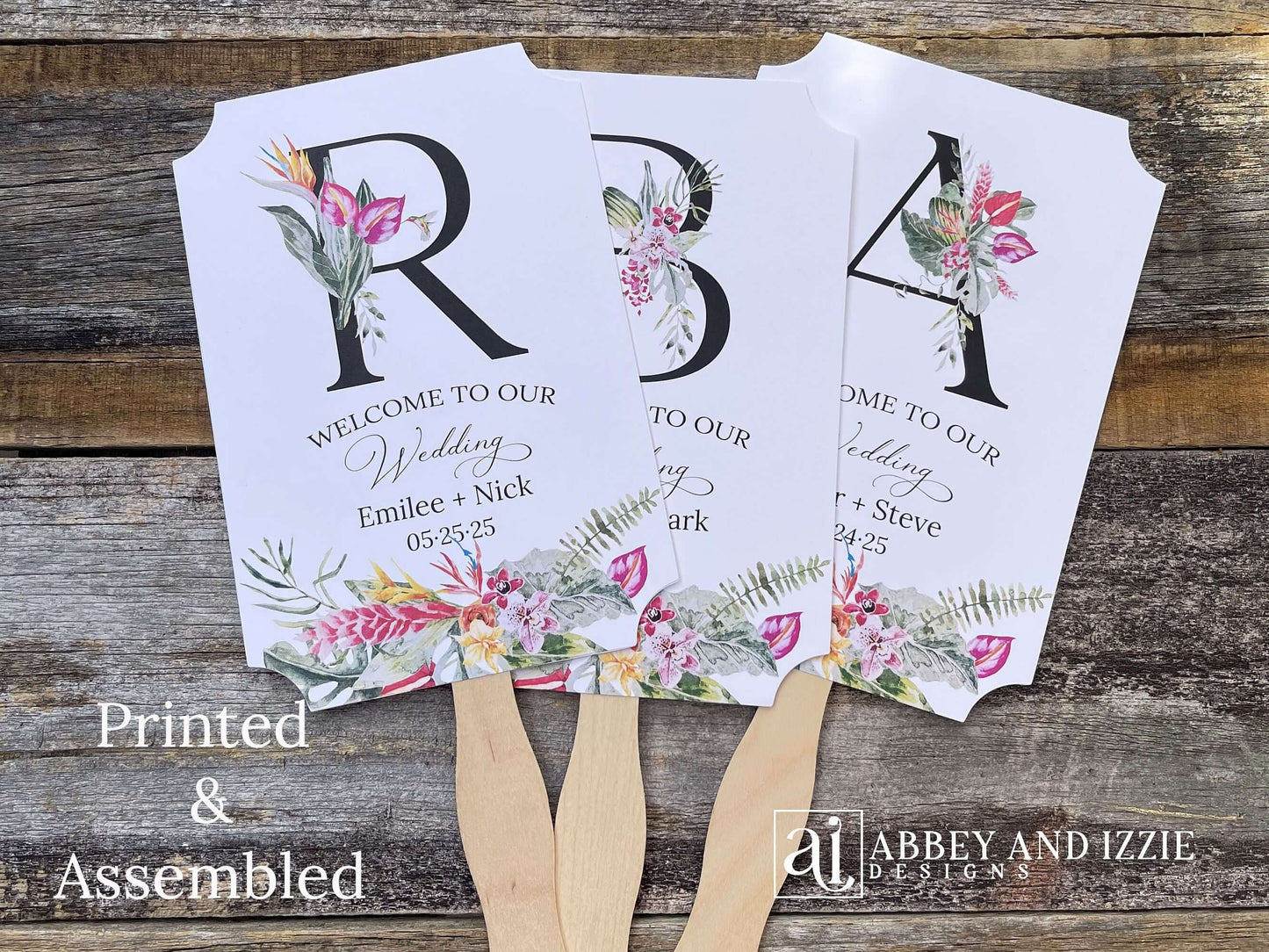 Tropical themed wedding fans monogrammed that are personalized with your large initial, bride and grooms names and wedding date. Adorned with tropical flowers, printed on white card stock. A great keepsake to take home as well as keeping your guests comfortable. Perfect for destination weddings.
