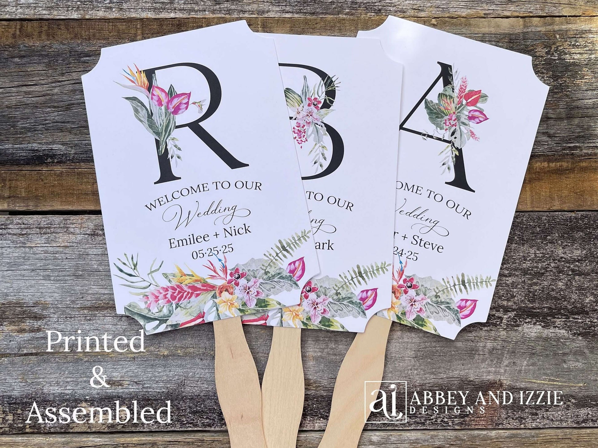 Tropical themed wedding fans monogrammed that are personalized with your large initial, bride and grooms names and wedding date. Adorned with tropical flowers, printed on white card stock. A great keepsake to take home as well as keeping your guests comfortable. Perfect for destination weddings.