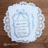 Personalized first birthday party favor bags, 'one is sweet, enjoy a treat, thank you for making my day complete'.  Printed on white paper bags and adorneed with a blue bow and border these will add a touch of elegance to the treat table. 