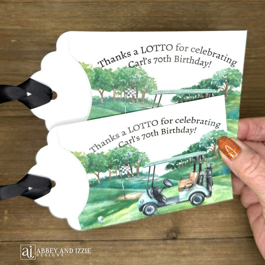 Golf theme birthday party favors, slide a lotto ticket in these cute envelopes for a fun favor.  Printed on white card stock with a black ribbon attached, these are adorned with a golf scene and are personalized for the guest of honor.