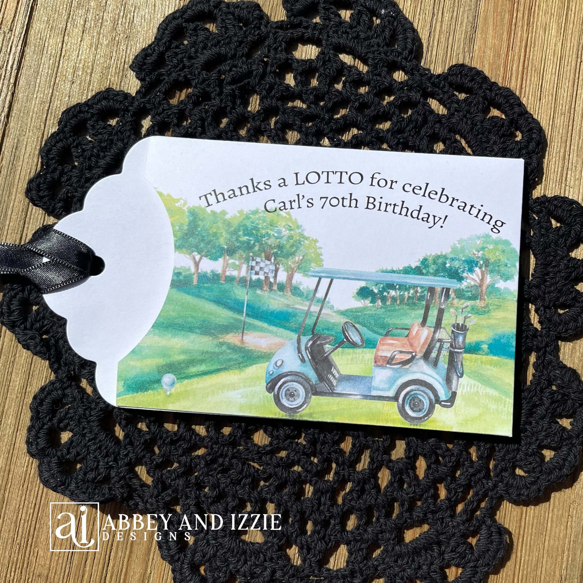 Golf theme birthday party favors, slide a lotto ticket in these cute envelopes for a fun favor.  Printed on white card stock with a black ribbon attached, these are adorned with a golf scene and are personalized for the guest of honor.