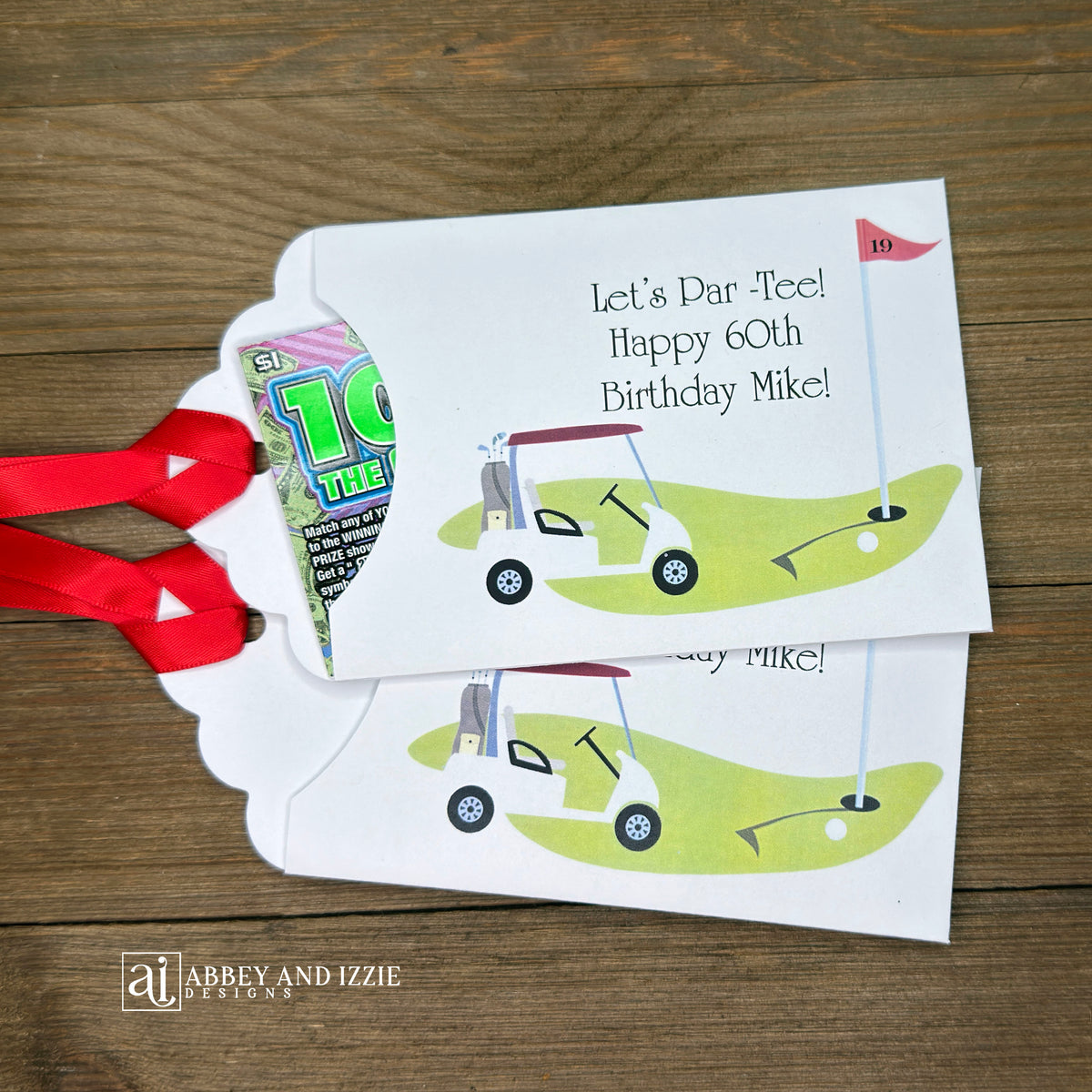 Golf Birthday Party Favors, personalized for the guest of honor, slide a lotto ticket in these envelopes for a fun favor.  White envelopes with red ribbon attahced, with a golf scene printed and Let's Par-Tee!  Happy Birthday to the guest of honor.