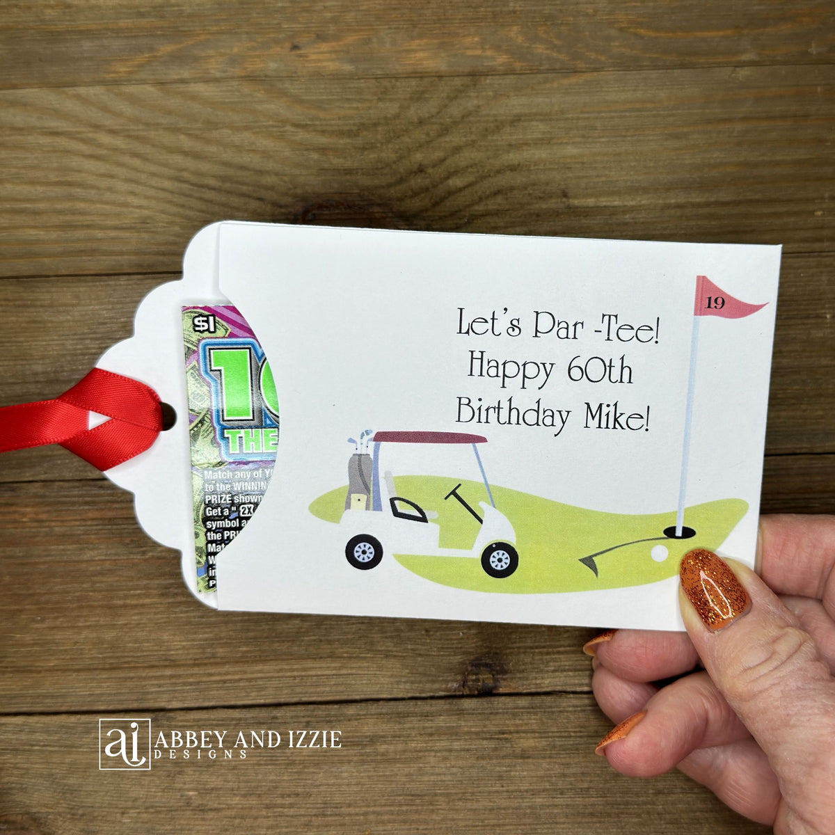 Golf Birthday Party Favors, personalized for the guest of honor, slide a lotto ticket in these envelopes for a fun favor.  White envelopes with red ribbon attahced, with a golf scene printed and Let's Par-Tee!  Happy Birthday to the guest of honor.