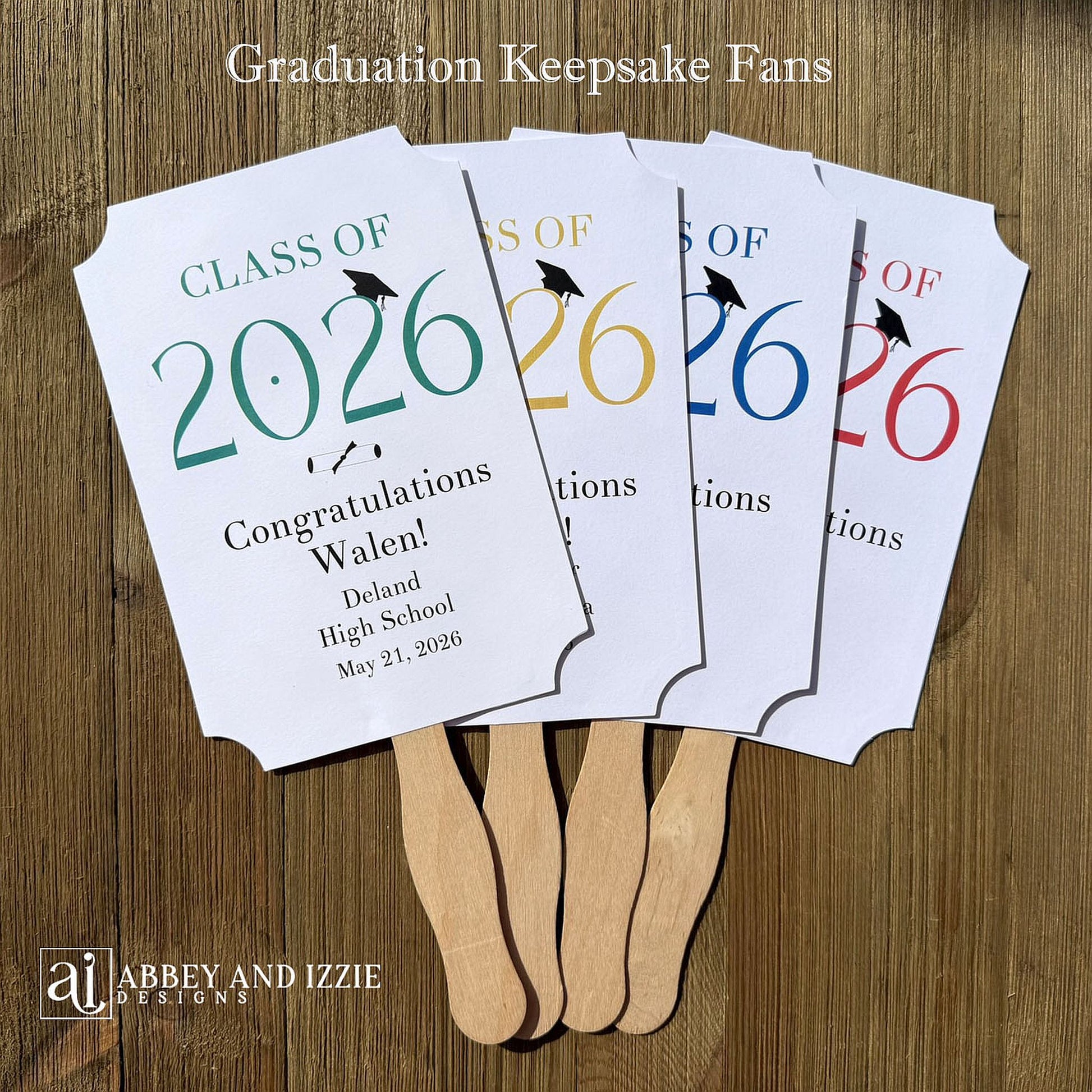  Personalized Graduation Fansto keep guest cool and a fun keepsake to take home. Each printed on white card stock, ship fully assembled, two sided with handle hidden between.  Your choice of year color.
