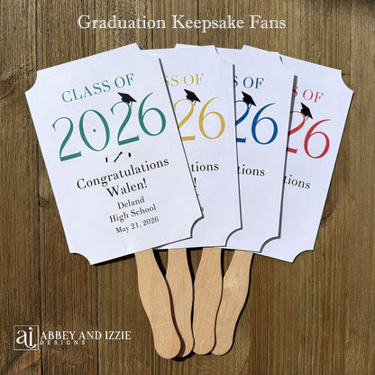  Personalized Graduation Fansto keep guest cool and a fun keepsake to take home. Each printed on white card stock, ship fully assembled, two sided with handle hidden between.  Your choice of year color.