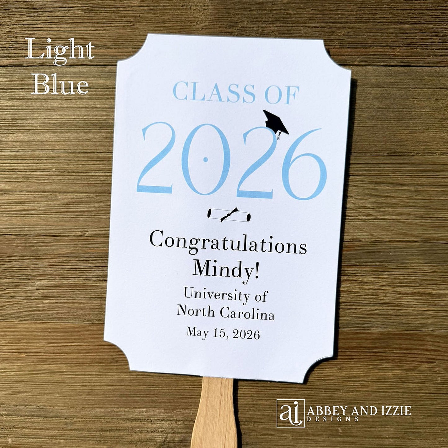  Personalized Graduation Fansto keep guest cool and a fun keepsake to take home. Each printed on white card stock, ship fully assembled, two sided with handle hidden between.  Your choice of year color.